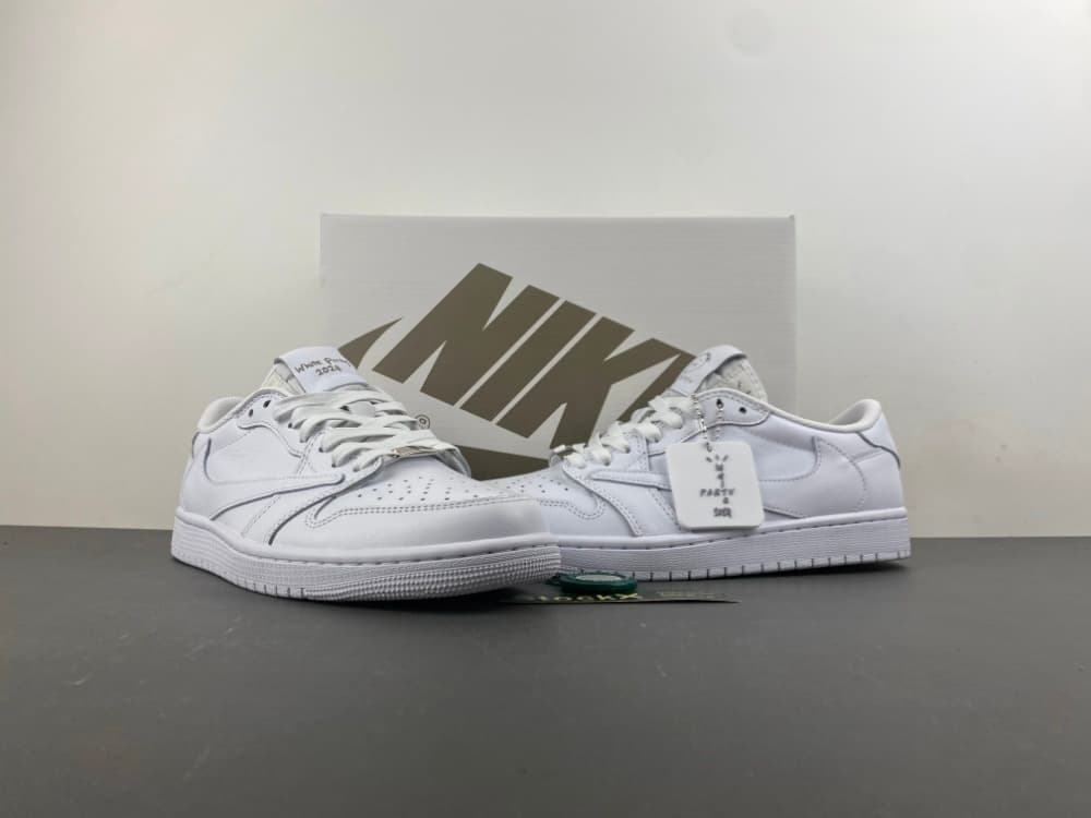 tA edition. Travis Scott x Air Jordan 1, all-white, Swoosh low-top.
