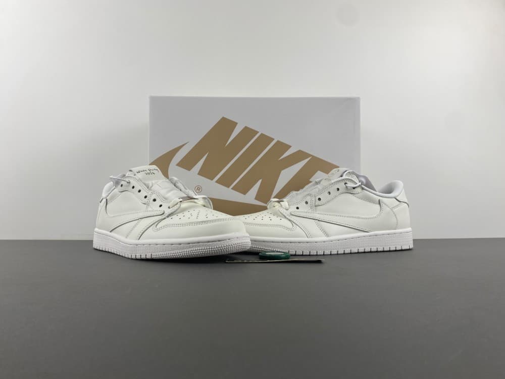 Travis Scott x Air Jordan 1 Low in full white with inverted Swoosh low-top design.